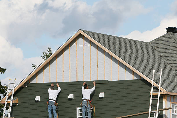 Professional Siding technician working in Franklin Square, NY